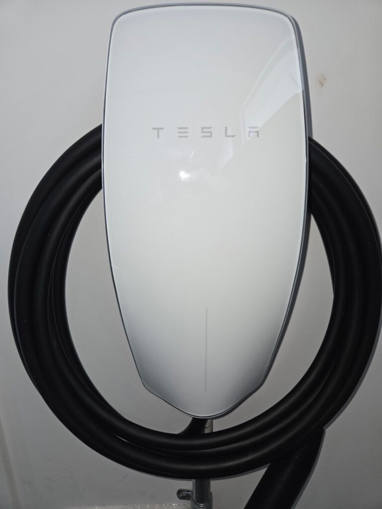 Home electric vehicle charger installation with clean cable routing